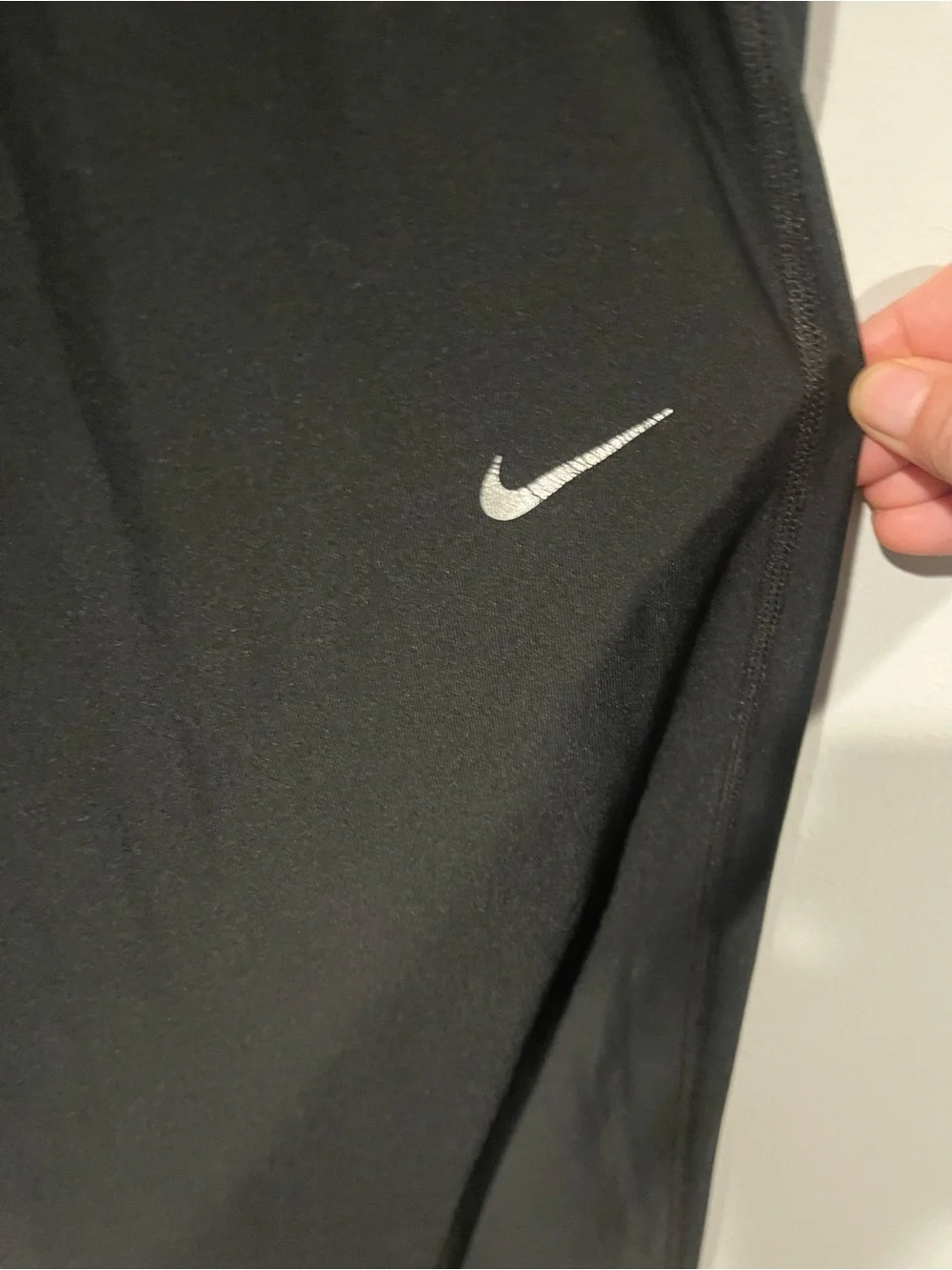 Nike Black Track Pants with White Swoosh and Ankle Zips